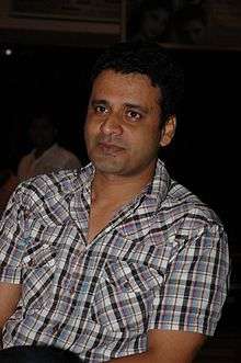 Manoj Bajpai is looking away from the camera.