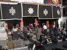 Pilgrims praying outdoors