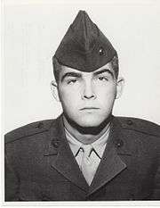 A black and white image of Martini in his military dress uniform with hat