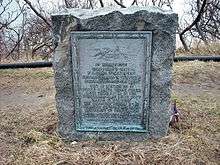 Memorial plaque and stone