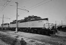 An electric locomotive with its pantographs down