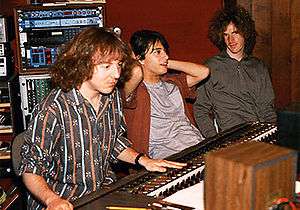 Three men at a mixing board