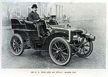 Man sitting in open-top vehicle