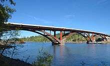 Concrete and brown metal bridge