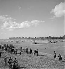 Small photo of tanks kicking up clouds of dust