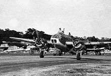 Twin-engined military aircraft on runway