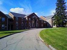 Picture of a building with a road leading up to it