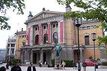 Building with stone columns at the base, and marble columns on the top portion.