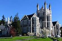 Gothic style building on a green knoll