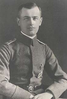 Black-and-white photo of a man wearing a military uniform.