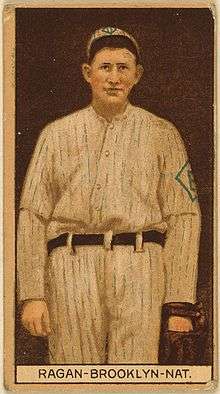 A sepia-toned baseball card image of a man in an old-style white pinstriped baseball uniform and cap