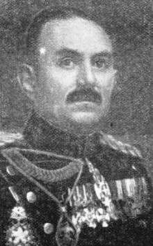 black and white portrait of a dark-haired man wearing dress uniform with medals