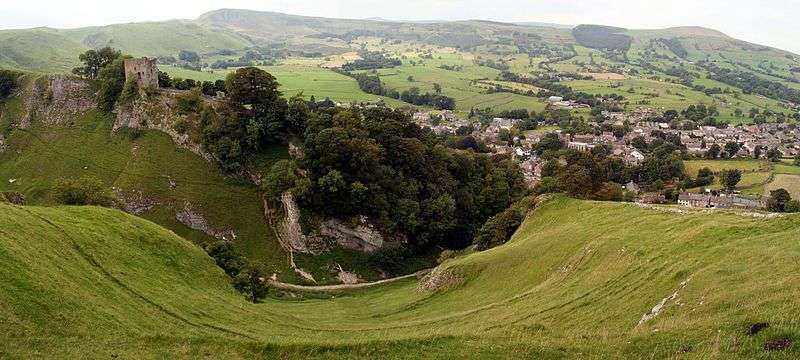 A view into Hope Valley. Peveril Castle is on the right, standing tall above the landscape, and below on the right is the settlement of Castleton.