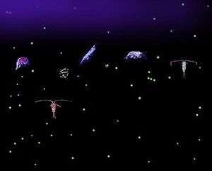 Six relatively large variously-shaped organisms with dozens of small light-colored dots all against a dark background. Some of the organisms have antennae that are longer than their bodies.