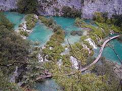 Turqois colored lakes among white rocks.