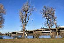 A box girder freeway bridge on thin pillars.