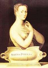 The upper body, unclothed, of a young woman carrying a thin transparent cloth. She has tight curled hair swept from her face, and is facing towards the left although her eyes look directly from the painting. A plaque in front of her carries the words "Sabina Poppea".