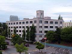 Photograph of the Powers Warehouse and Factory, a 5-story building on a sloped site