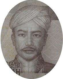 A man in a turban, looking forward