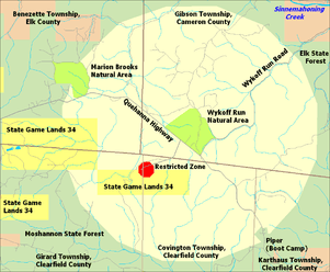 A large nearly circular area in ivory is surrounded by pale green, with a small red octagon off-center and three long yellow rectangles at left.