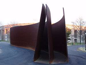 three curved weathering steel plates