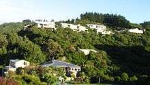 Photo of Raphael House Rudolf Steiner School in Belmont, Lower Hutt from the road that runs below