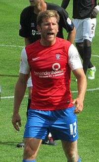 Richard Cresswell talking while standing on a grass field