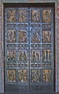  A pair of bronze doors divided into sixteen panels containing reliefs depicting scenes mainly from the life of Jesus and stories that he told.