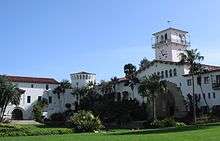 Photograph of the gardens and Spanish colonial façade of the Santa Barbara County Courthouse