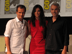 Photograph of producer David Heyman, actress Sandra Bullock and director Alfonso Cuarón attending San Diego Comic-Con in 2013