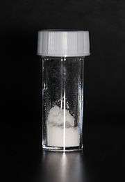 White powder in a stoppered glass vial