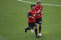 Teammates Sergio Agüero and Diego Forlán training at the Emirates Stadium side-by-side.