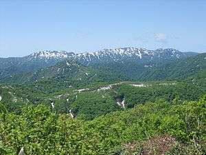 A forested mountain landscape.