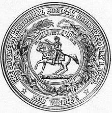 Circular seal with the motto: "The Southern Historical Society, Organized May 1, 1869; Deo Vindice" The central device is a man on a horse, with the text "Re-organized Aug.15.1873.", surrounded by a wreath of assorted plants.