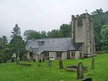 A rendered low church with a battlemented tower