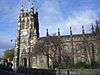 A Gothic church with elaborate pinnacles on the body of the church and on the west tower