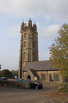 Yellow stone church and tower.