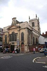 A Georgian church seen from the northeast, with a Venetian east window, and a Gothic tower with pinnacles at the west end