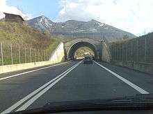 Straight-ahead view of highway, approaching an overpass