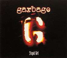 A stylized "G" resembling a branding iron. Above is "Garbage" in neon-like letters, and below "Stupid Girl".