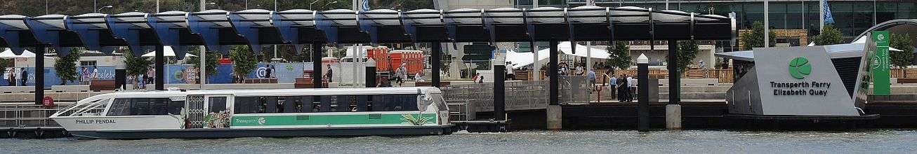 Ferry in water in front of jetty