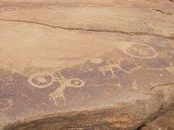 Various drawings on a cave wall.