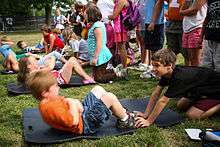 Picture of school children doing sit-ups