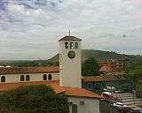  A large tower with a huge clock.