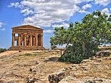 Ruins of a classical temple with columns.