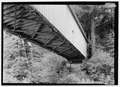 View of wooden covered bridge from below