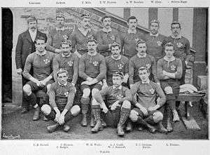 The full Welsh squad lining up for the purpose of a pre-match photo. Gould is seated centrally, dwarfed by his larger team-mates.