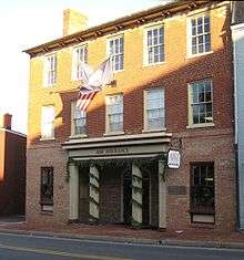 Photograph of a three-story brick office building