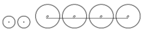 Diagram of two small leading wheels, and four large driving wheels joined by a coupling rod