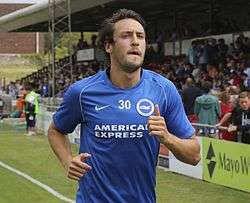 A young man wearing a blue shirt.